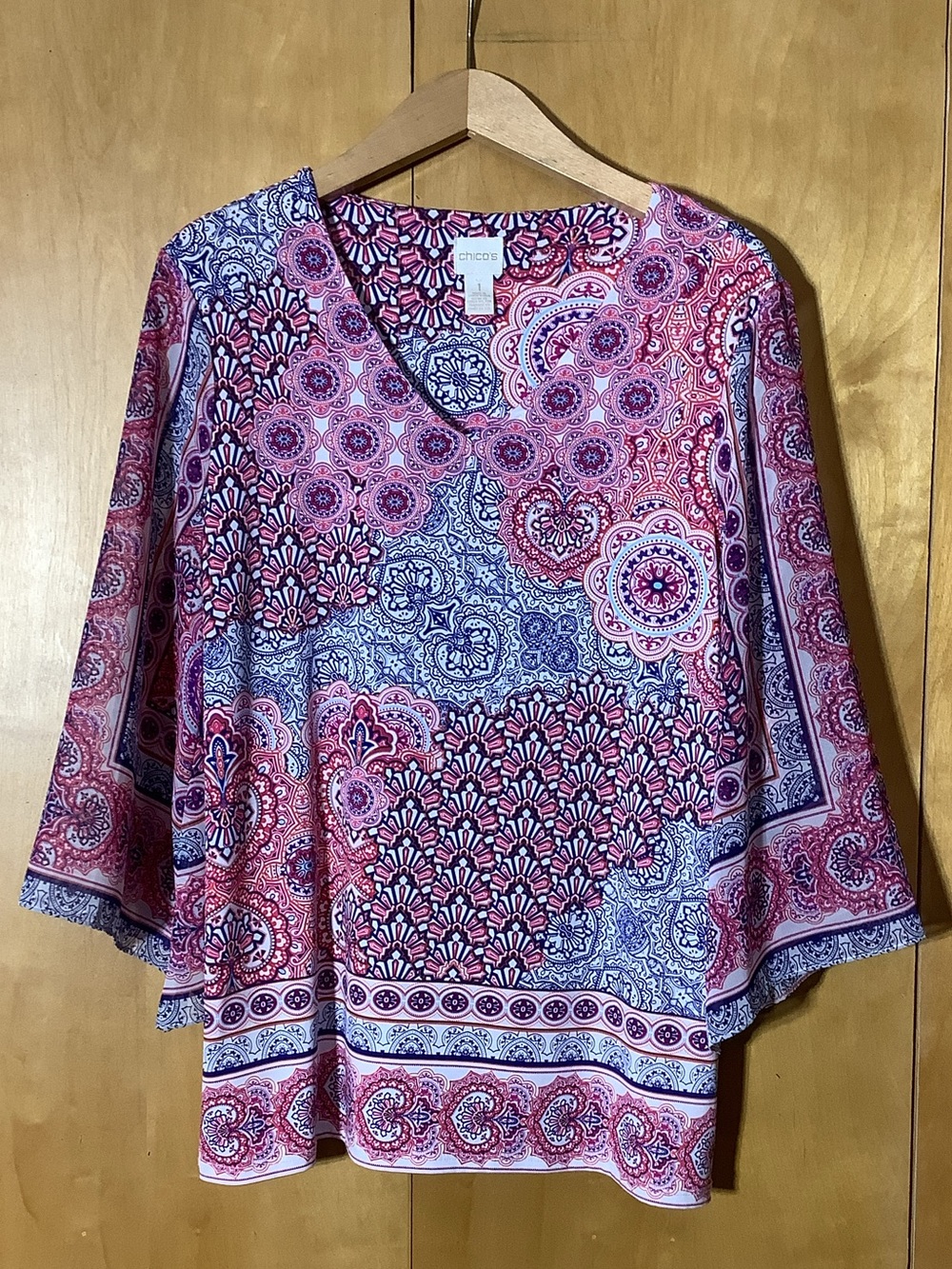 Chico’s graphic angle sleeved tunic, size medium